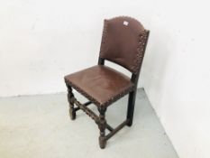 A VINTAGE BROWN LEATHER BUTTON BACK CHAIR.