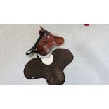 A SMALL LEATHER PONY SADDLE.