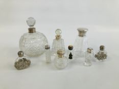 COLLECTION OF MAINLY CUT GLASS PERFUME BOTTLES TO INCLUDE FOUR SILVER TOPPED EXAMPLES, ETC.