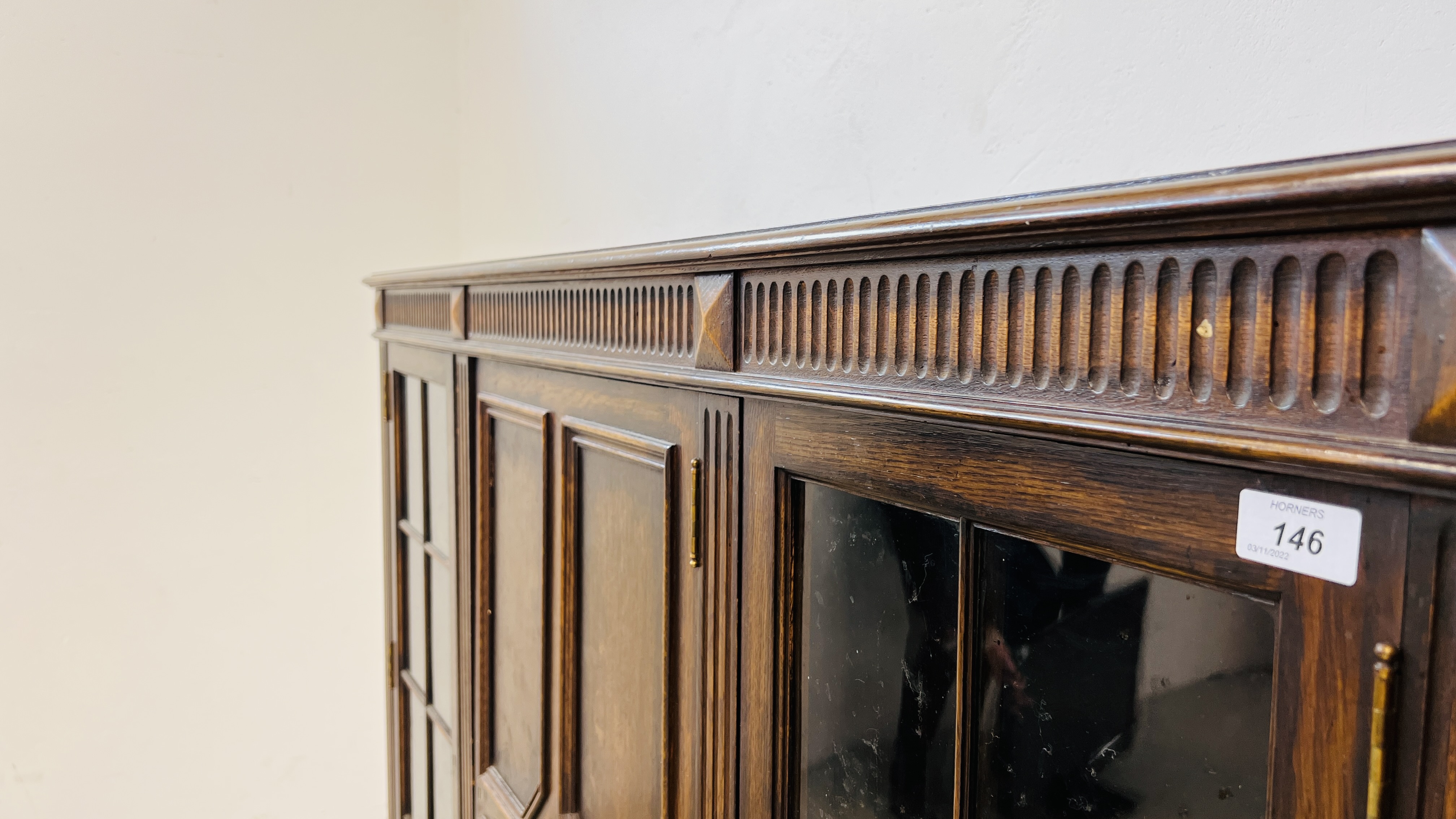 A 1930's OAK THREE DOOR CABINET STANDING ON LEG, - Image 5 of 13