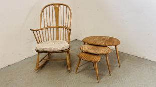 A NEST OF THREE GRADUATED ERCOL STYLE KIDNEY SHAPED OCCASIONAL TABLES AND ERCOL STYLE STICK BACK