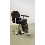 A LEATHER BARBERS CHAIR ON STAINLESS STEEL SUPPORT.