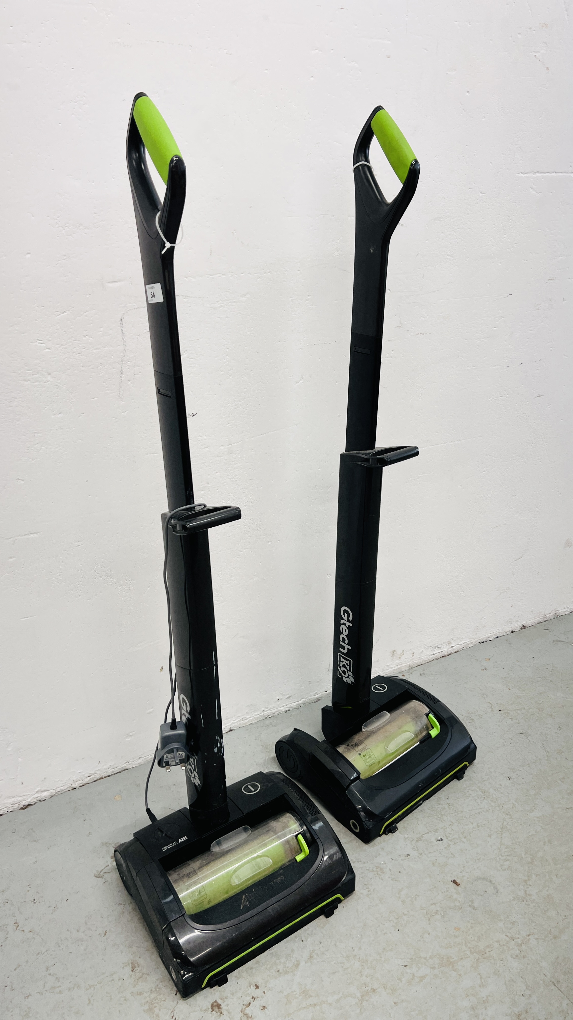 TWO GTECH K9 AIR RAM 22V LITHIUM-ION CORDLESS VACUUM CLEANERS COMPLETE WITH ONE BATTERY AND CHARGER