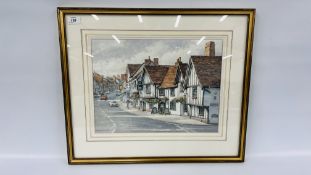 AN ORIGINAL WATERCOLOUR "HIGH STREET LAVENHAM SUFFOLK" BEARING SIGNATURE GODFREY ARNISON WIDTH 42CM.