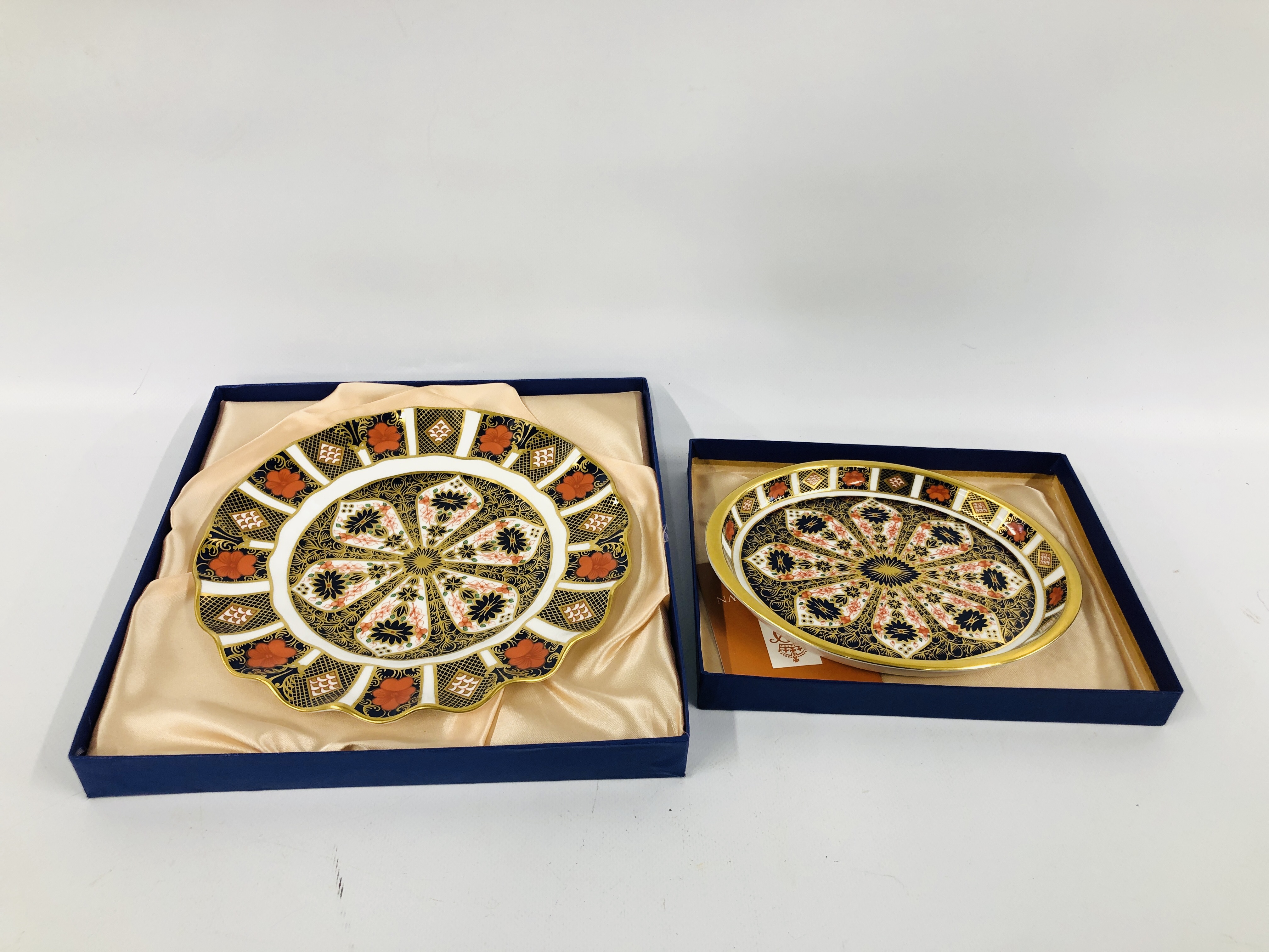 TWO ROYAL CROWN DERBY PLATES IN ORIGINAL BOXES.