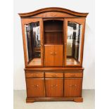 A GOOD QUALITY REPRODUCTION CHERRY WOOD FINISH DISPLAY CABINET ON THREE DRAWER THREE DOOR BASE.