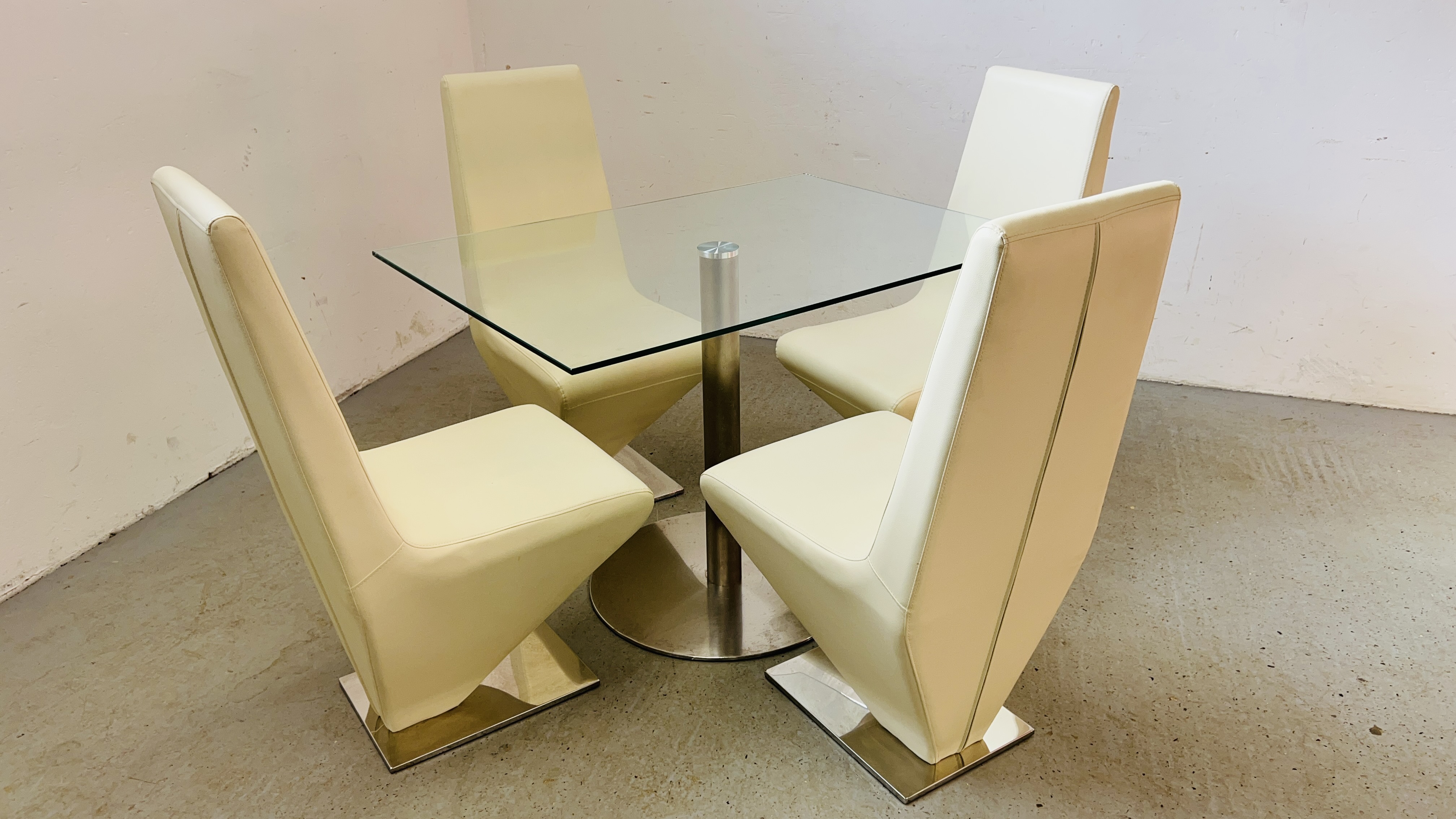 A MODERN DESIGNER GLASS TOP RECTANGULAR DINING TABLE SUPPORTED BY STAINLESS STEEL PEDESTAL COMPLETE