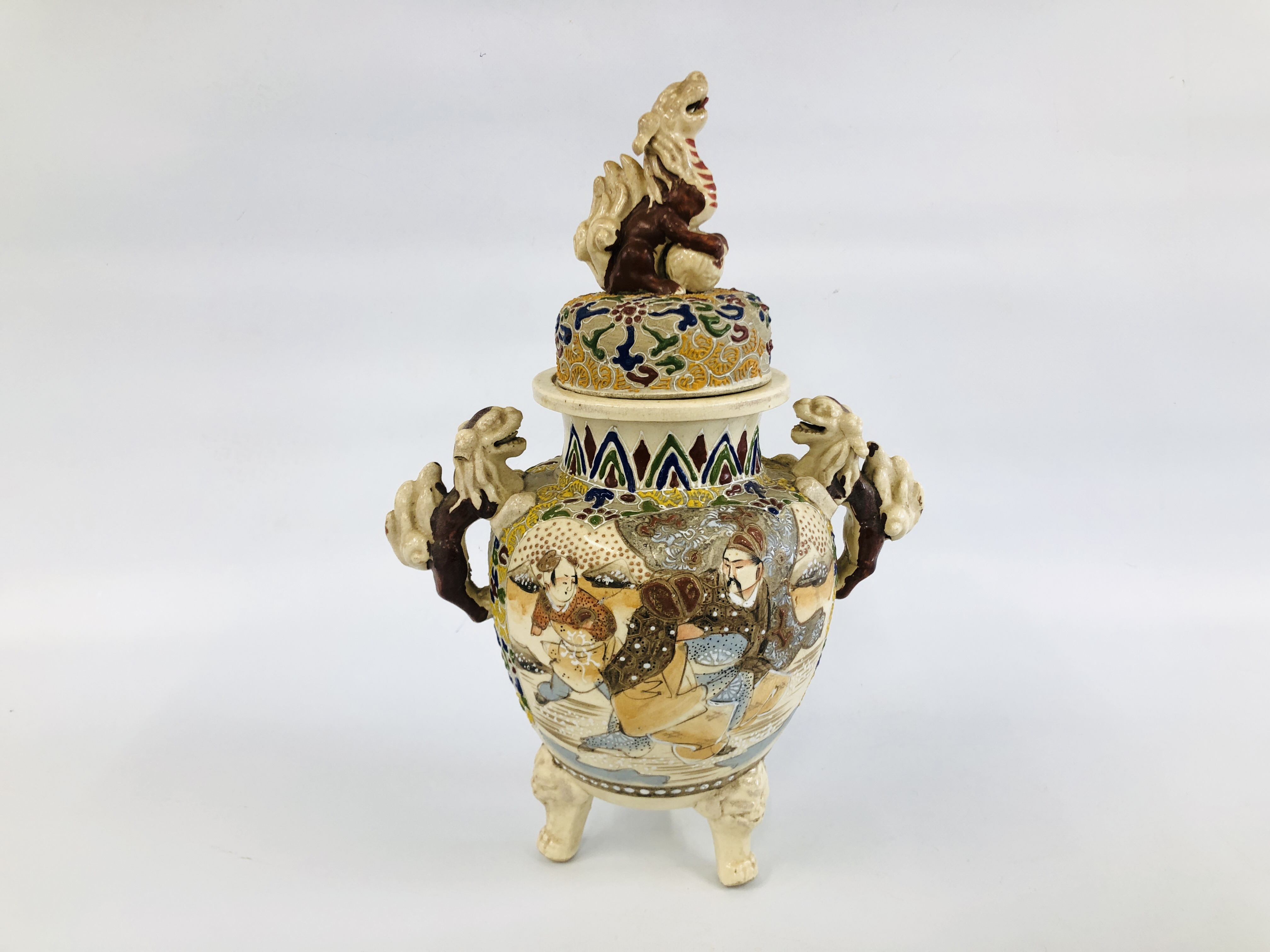 CHINESE STONEWARE URN SUPPORTED BY THREE FOO DOG FEET AND FOO DOG DETAILING A/F