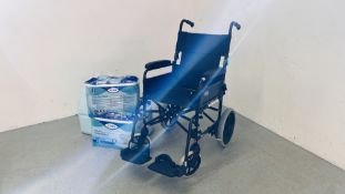 AN INVACARE COLLAPSIBLE WHEEL CHAIR AND THREE PACKS OF TENA PADS