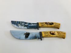 TWO DECORATIVE STAINLESS KNIVES ONE DEPICTING EAGLE THE OTHER WINTER WOLF SCENE (COLLECTION ONLY,
