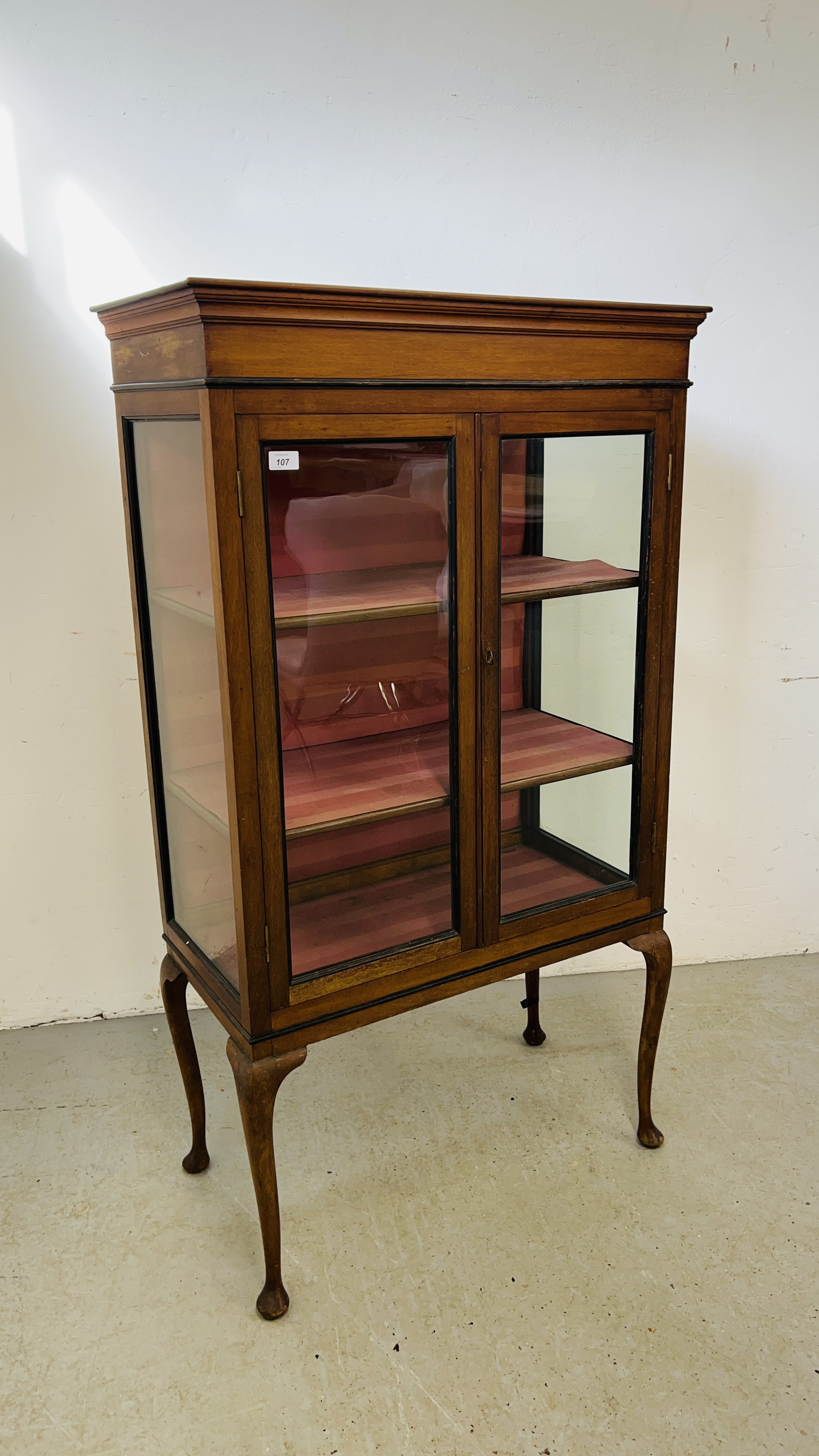 MAHOGANY TWO DOOR GLAZED DISPLAY CABINET STANDING ON LEGS DEPTH 40CM. WIDTH 78CM. HEIGHT 140CM.