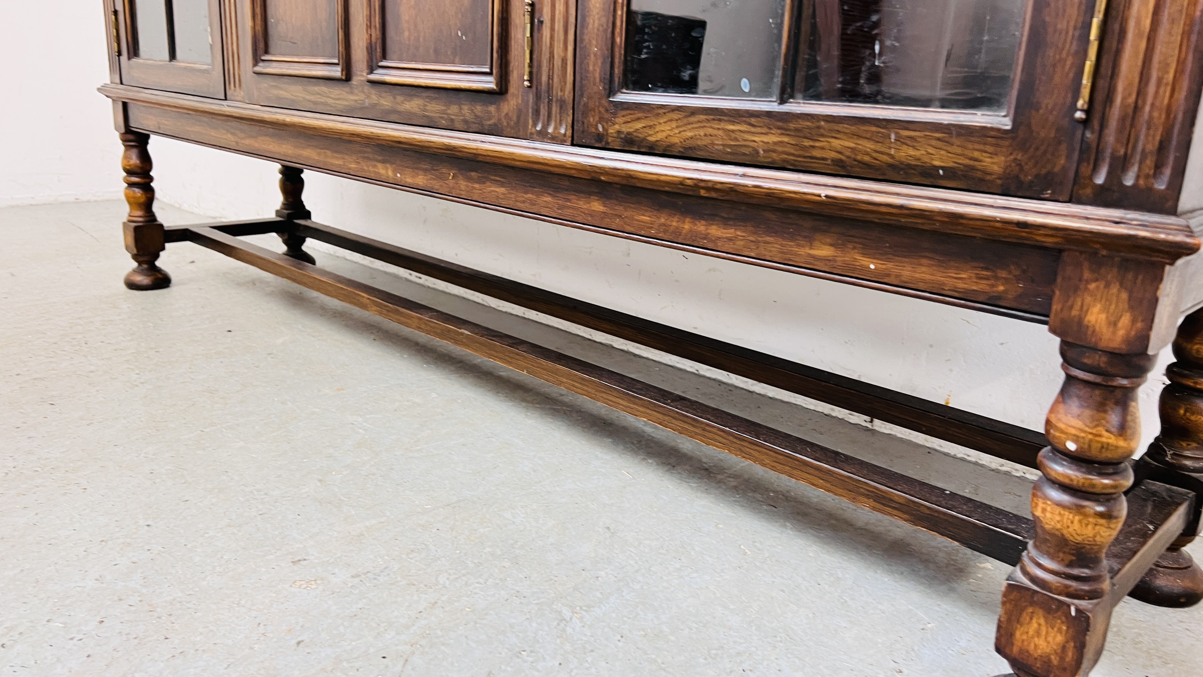 A 1930's OAK THREE DOOR CABINET STANDING ON LEG, - Image 13 of 13