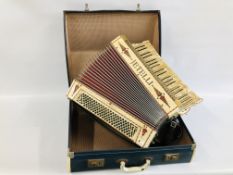 A VINTAGE JETELINA ACCORDION WITH HIGHLY DECORATIVE DETAILING IN HARD TRAVEL CASE.