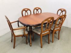 A GOOD QUALITY REPRODUCTION EXTENDING CHERRY WOOD FINISH DINING TABLE COMPLETE WITH A SET OF SIX