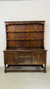 AN OAK DRESSER THE BASE WITH CUPBOARDS AND DOORS W 158CM, D 54CM, H 195CM.