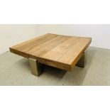 A DESIGNER CONTEMPORARY COFFEE/CENTRE TABLE THE TOP FORMED FROM 4 INCH THICK HARDWOOD WITH