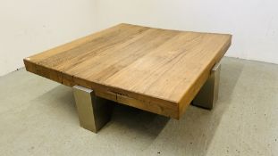 A DESIGNER CONTEMPORARY COFFEE/CENTRE TABLE THE TOP FORMED FROM 4 INCH THICK HARDWOOD WITH
