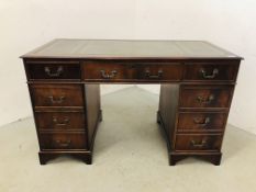 REPRODUCTION TWIN PEDESTAL NINE DRAWER KNEEHOLE DESK WITH TOOLED LEATHER TOP.