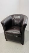 A DARK TAN FAUX LEATHER TUB CHAIR