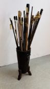 AN ARTS AND CRAFTS STYLE STAND CONTAINING A QUANTITY OF ASSORTED CLEANING RODS,