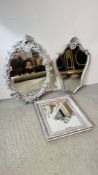THREE DECORATIVE MODERN SILVER FRAMED WALL HANGING MIRRORS OF VARIOUS SHAPES AND SIZES.