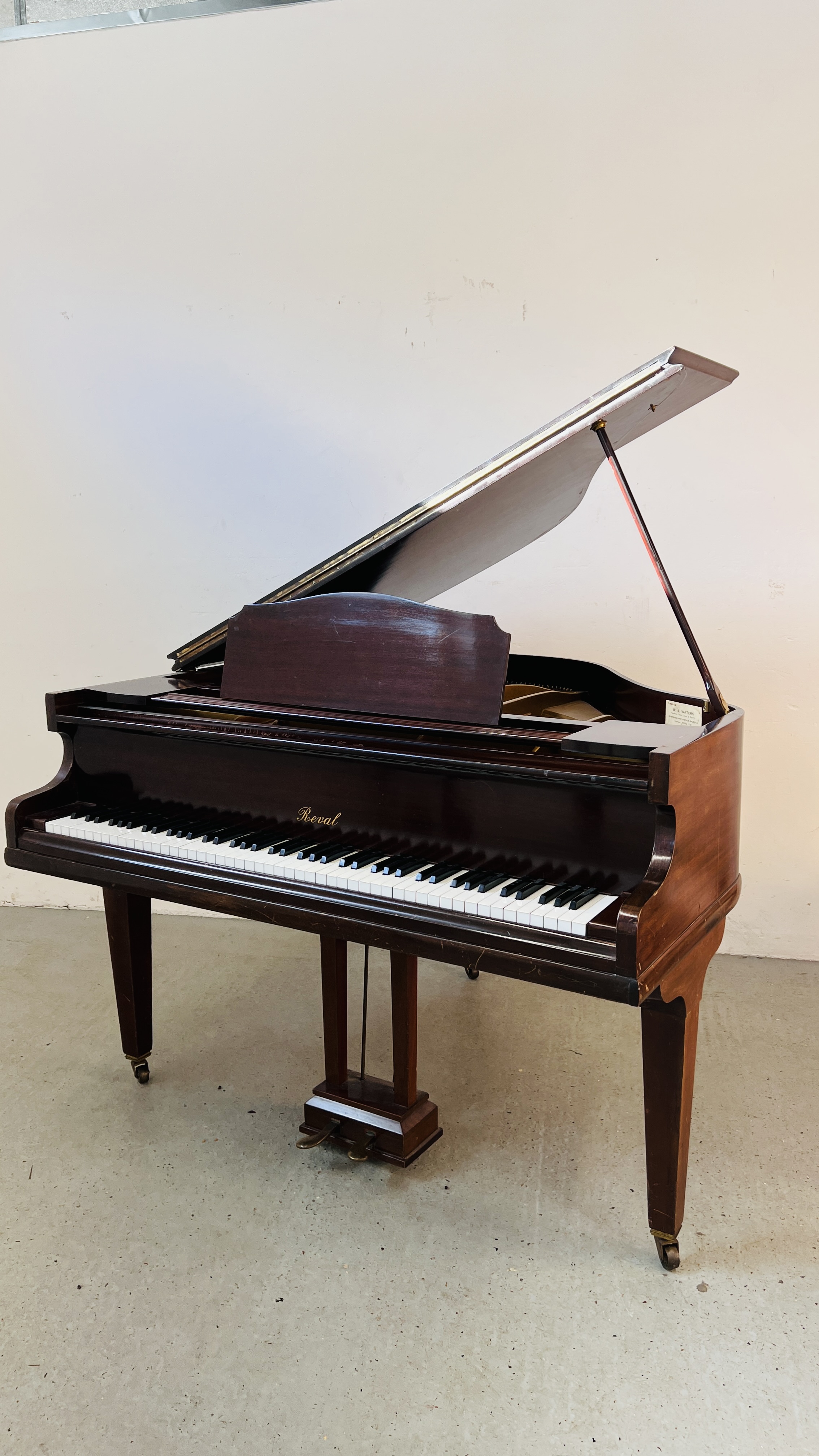 A REVAL BABY GRAND PIANO.