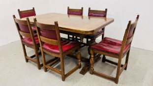 JACOBEAN OAK STYLE EXTENDING DINING TABLE ON A STRETCHER BASE ALONG WITH 6 RED FAUX LEATHER