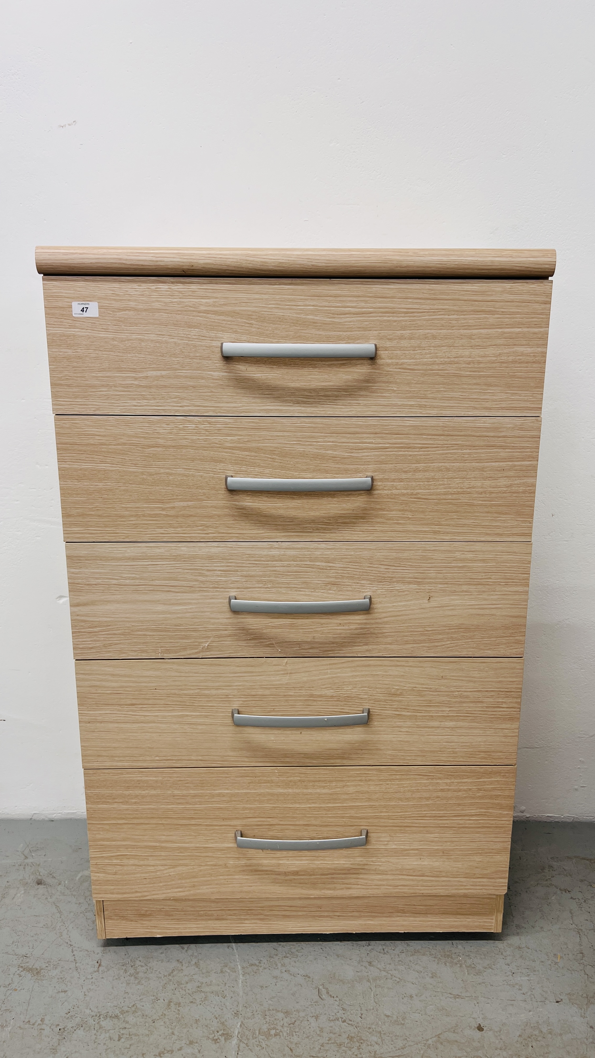 A MODERN LIGHT OAK FINISH FIVE DRAWER CHEST WIDTH 77CM. DEPTH 42CM. HEIGHT 126CM.