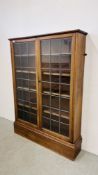 A MAHOGANY BOOKCASE WITH ADJUSTABLE SHELVES AND LEADED GLASS DOORS, W 111CM, D 25CM, H 152CM.
