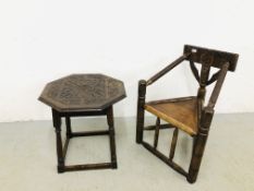 A SOLID OAK HEAVILY CARVED TURNER STYLE CHAIR ALONG WITH OAK CARVED OCCASIONAL TABLE