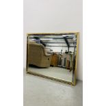 LARGE DESIGNER GILT FRAMED WALL MIRROR WITH BEVELLED GLASS WIDTH 104CM. HEIGHT 127CM.