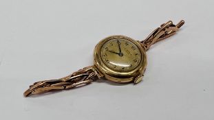 A LADY'S 9CT GOLD COCKTAIL WATCH BY J.W BENSON ON EXPANDING 9CT GOLD BRACELET STRAP.