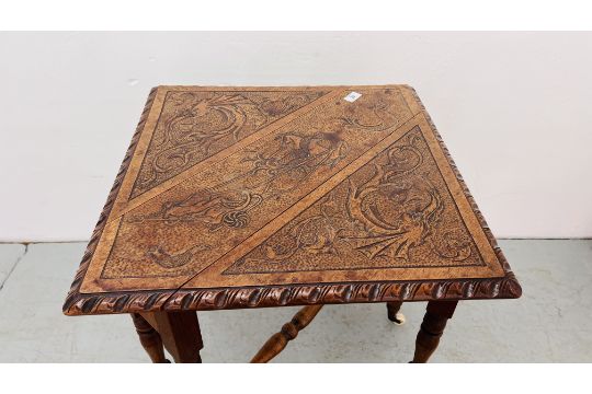 A MAHOGAY GATELEG OCCASIONAL TABLE WITH POKA ART DETAILING ON CERAMIC CASTORS WIDTH 77CM. X 75CM. - Image 7 of 8