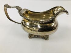 A GEORGE III SILVER SAUCEBOAT, WITH AN ANTHEMION DECORATED HANDLE,