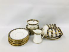 A GROUP OF ROYAL ALBERT AND ALFRED PEARCE GILT AND BLUE DECORATED TEAWARE ON A WHITE BACKGROUND
