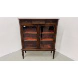 ANTIQUE MAHOGANY TWO DOOR GLAZED DISPLAY CABINET WITH VELVET UPHOLSTERED SHELVES STANDING ON REEDED