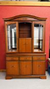 A GOOD QUALITY REPRODUCTION CHERRY WOOD FINISH DISPLAY CABINET ON THREE DRAWER THREE DOOR BASE.