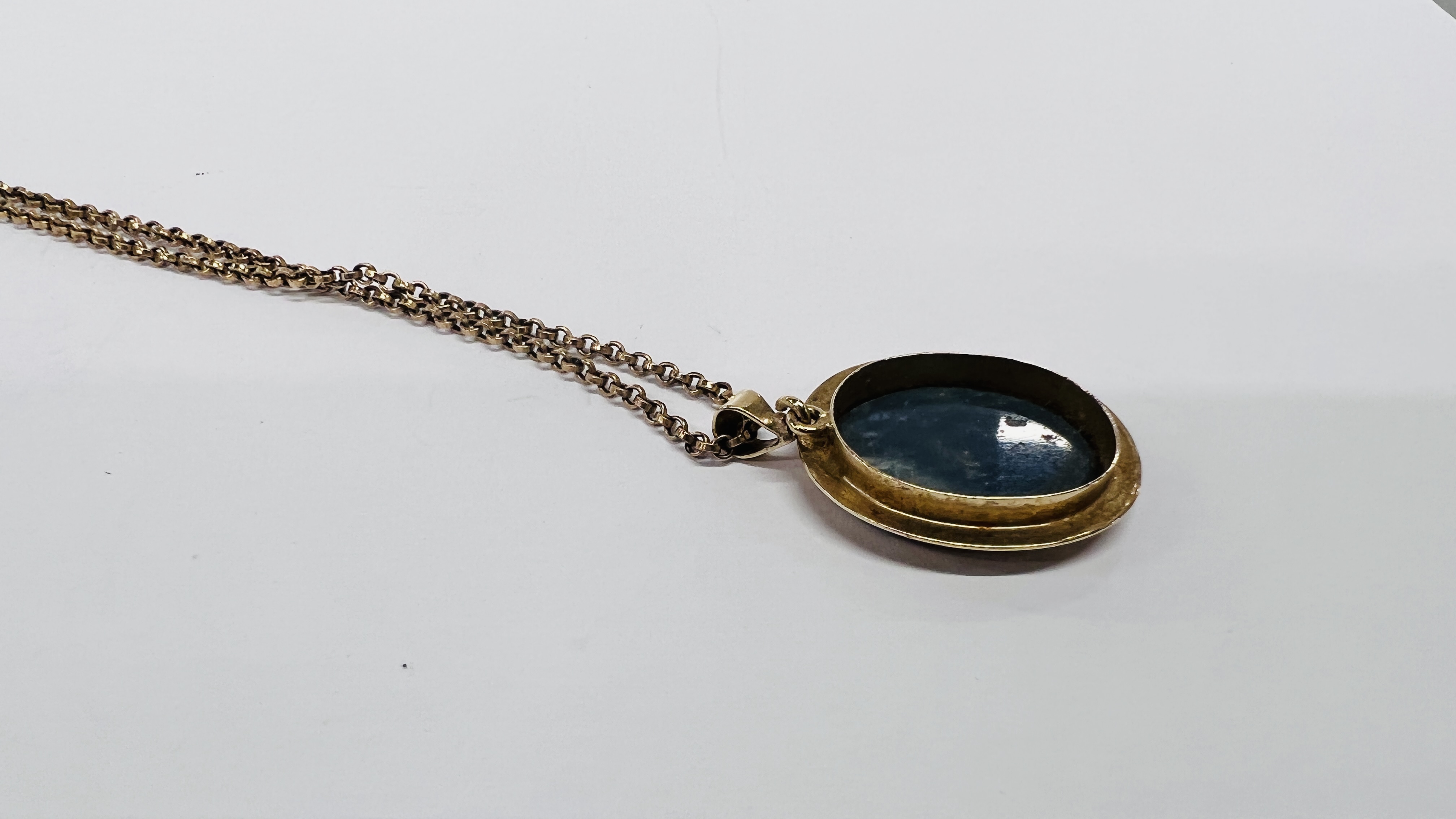 A 10CT PENDANT FRAMING AN OVAL OPAL ON A 9CT GOLD CHAIN. - Image 7 of 9