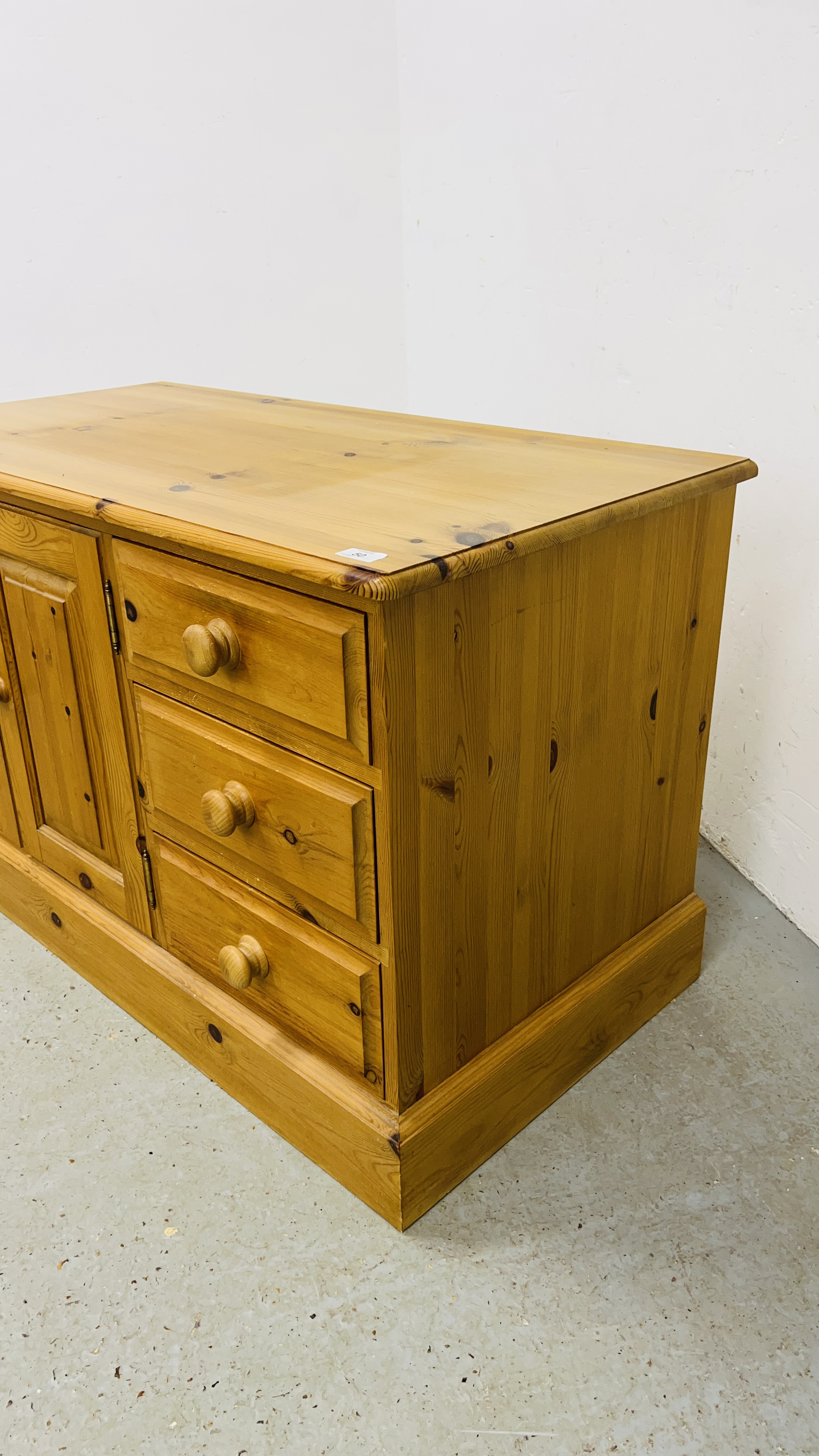 A SOLID WAXED PINE THREE DRAWER ENTERTAINMENT CABINET WIDTH 107CM. DEPTH 54CM. HEIGHT 65CM. - Image 2 of 9