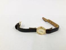 LADIES SOVEREIGN 9CT GOLD CASED WATCH ON BROWN LEATHER STRAP.