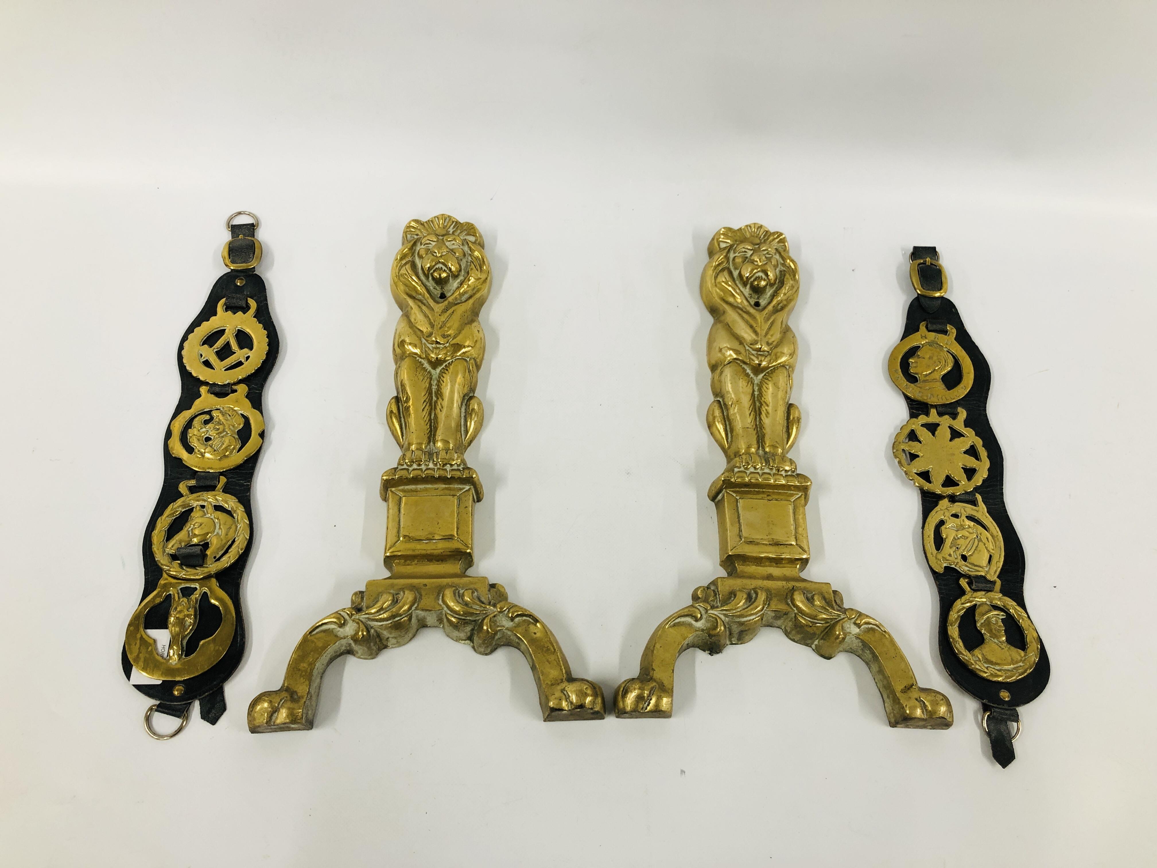 PAIR OF HEAVY BRASS FIRESIDE LIONS, EIGHT HORSE BRASSES ON TWO LEATHER STRAPS.