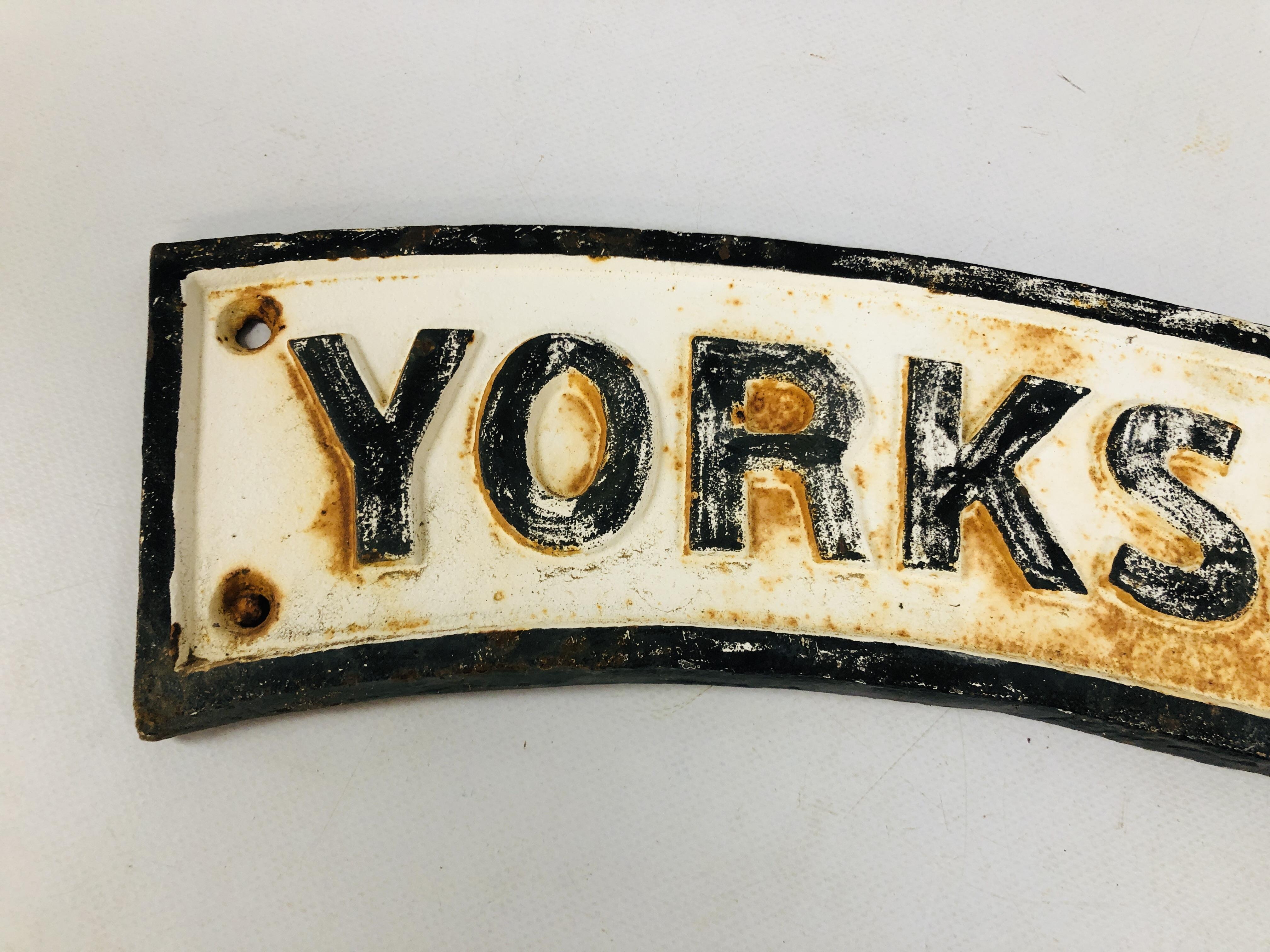 A REPRODUCTION CAST IRON "YORKSHIRE MAN" CURVED PLAQUE WIDTH 65CM. - Image 2 of 3