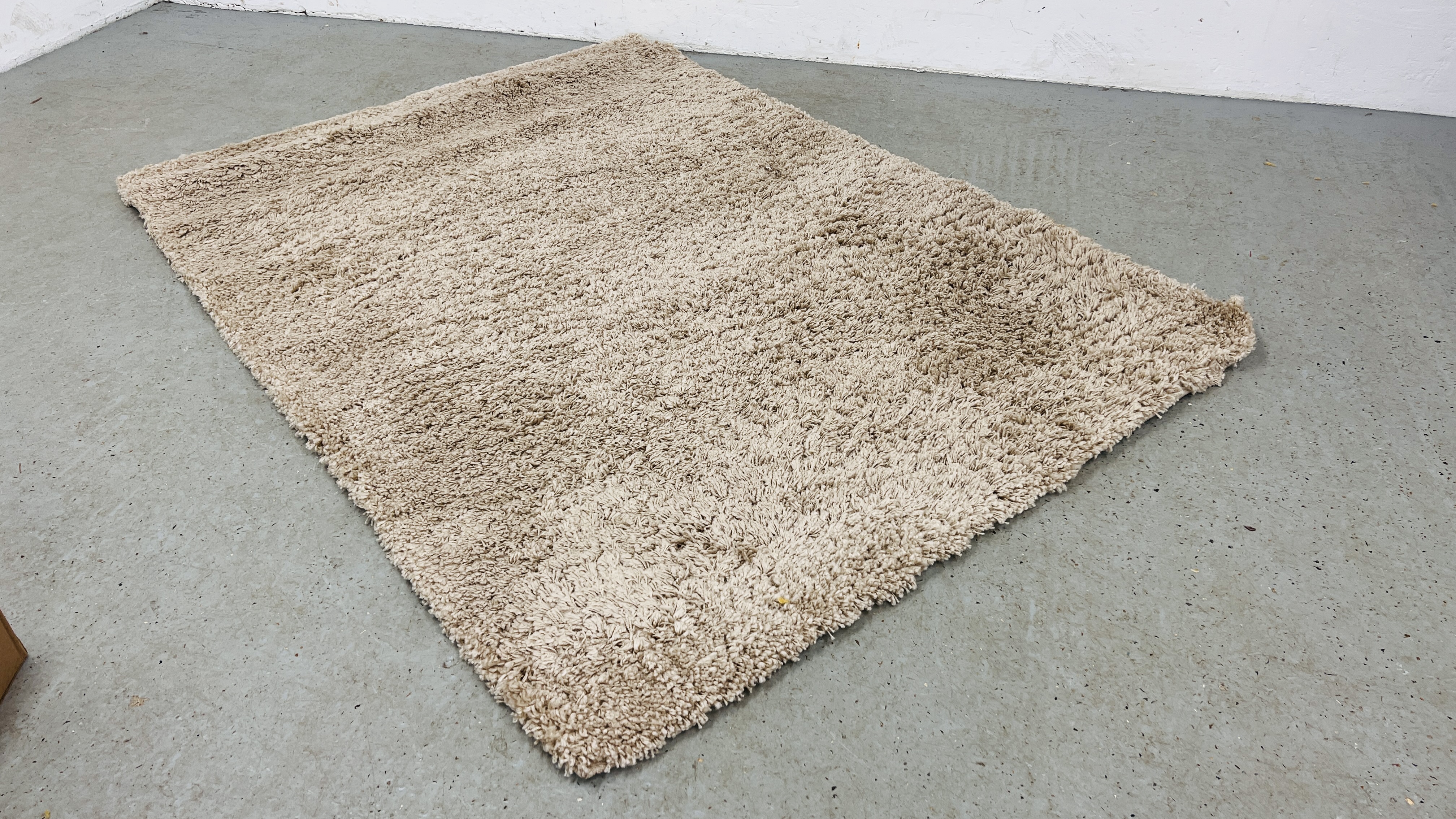 A NEXT LUXURY COSY LT NATURAL DEEP PILE RUG 135CM. X 190CM.