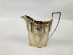 GEORGE III SILVER HELMET SHAPED MILK JUG THE BODY WITH LAUREL LEAVES,