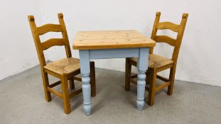 A SOLID PINE BREAKFAST TABLE WITH NATURAL WAXED FINISH TOP AND TWO SOLID BEECHWOOD DINING CHAIRS