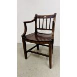 A COUNTRY MADE ELBOW CHAIR WITH WOODEN SEAT.