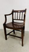 A COUNTRY MADE ELBOW CHAIR WITH WOODEN SEAT.