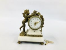 VINTAGE C19TH FRENCH GILDED ORMOLU AND WHITE MARBLE MANTEL CLOCK ON FOUR RAISED FEET ONE OF WHICH