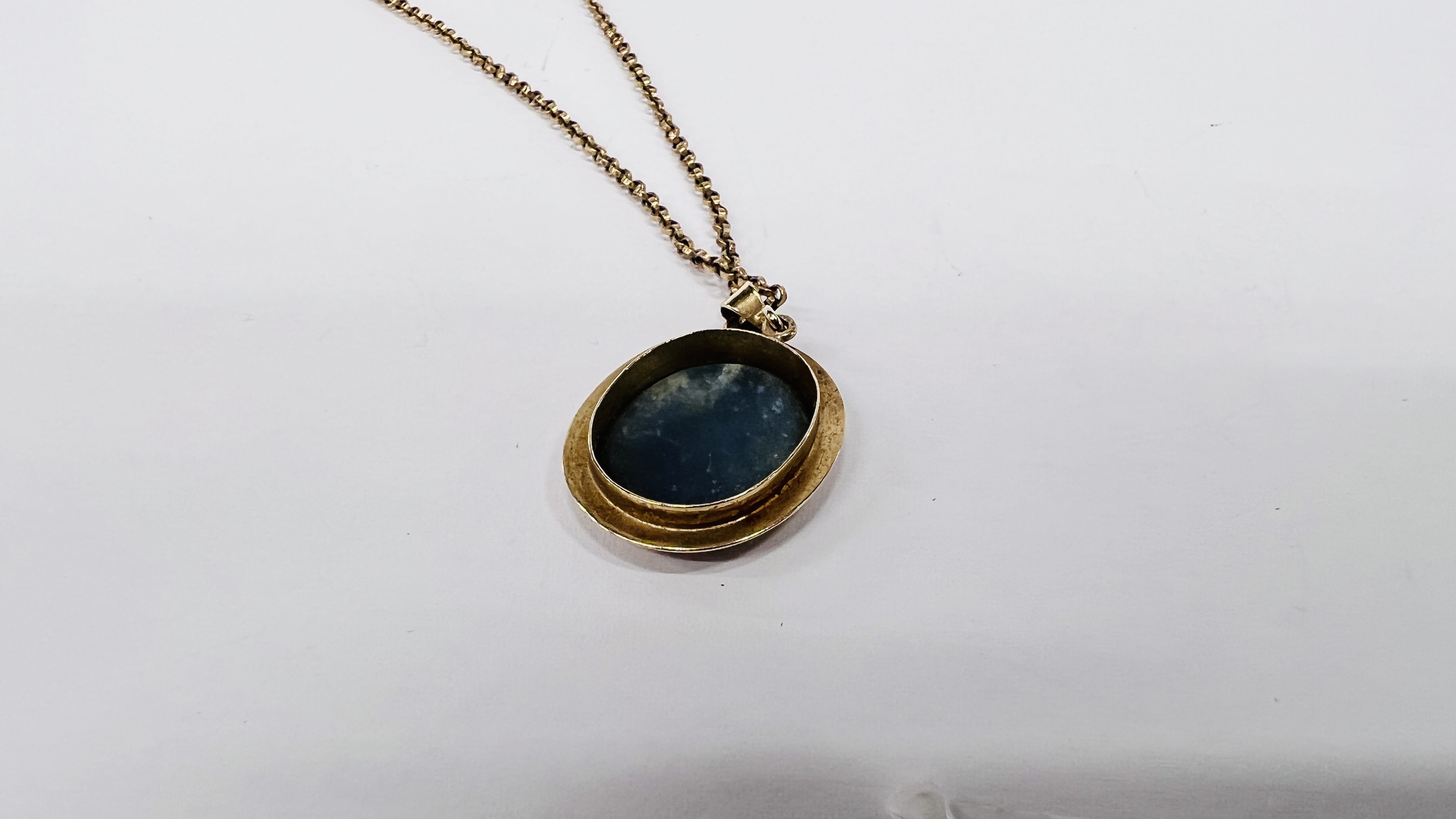 A 10CT PENDANT FRAMING AN OVAL OPAL ON A 9CT GOLD CHAIN. - Image 6 of 9