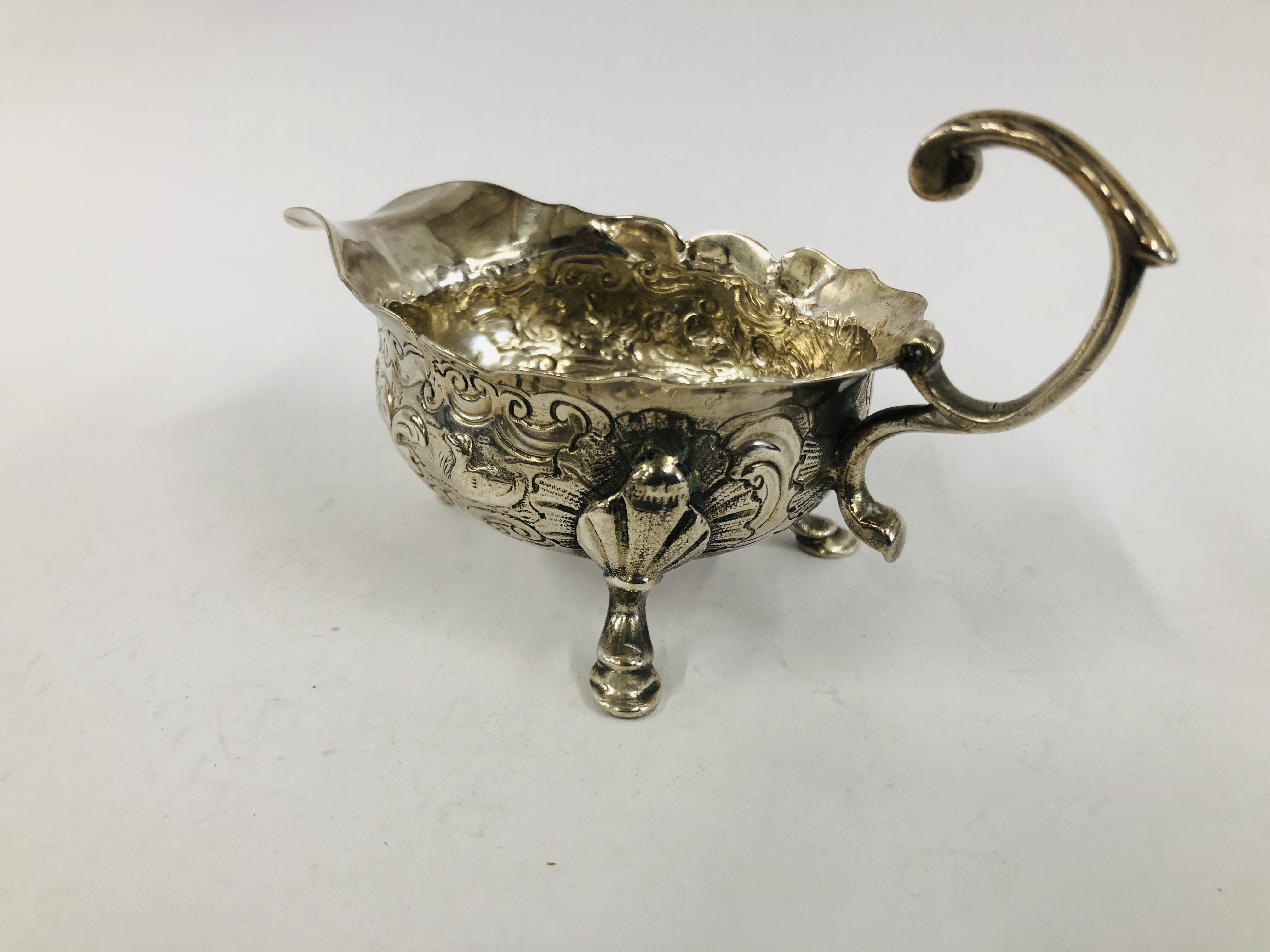 A GEORGE II SILVER CREAM BOAT WITH OPEN SCROLLED HANDLE THE BODY DECORATED WITH GEESE ON TRIPOD - Image 7 of 10